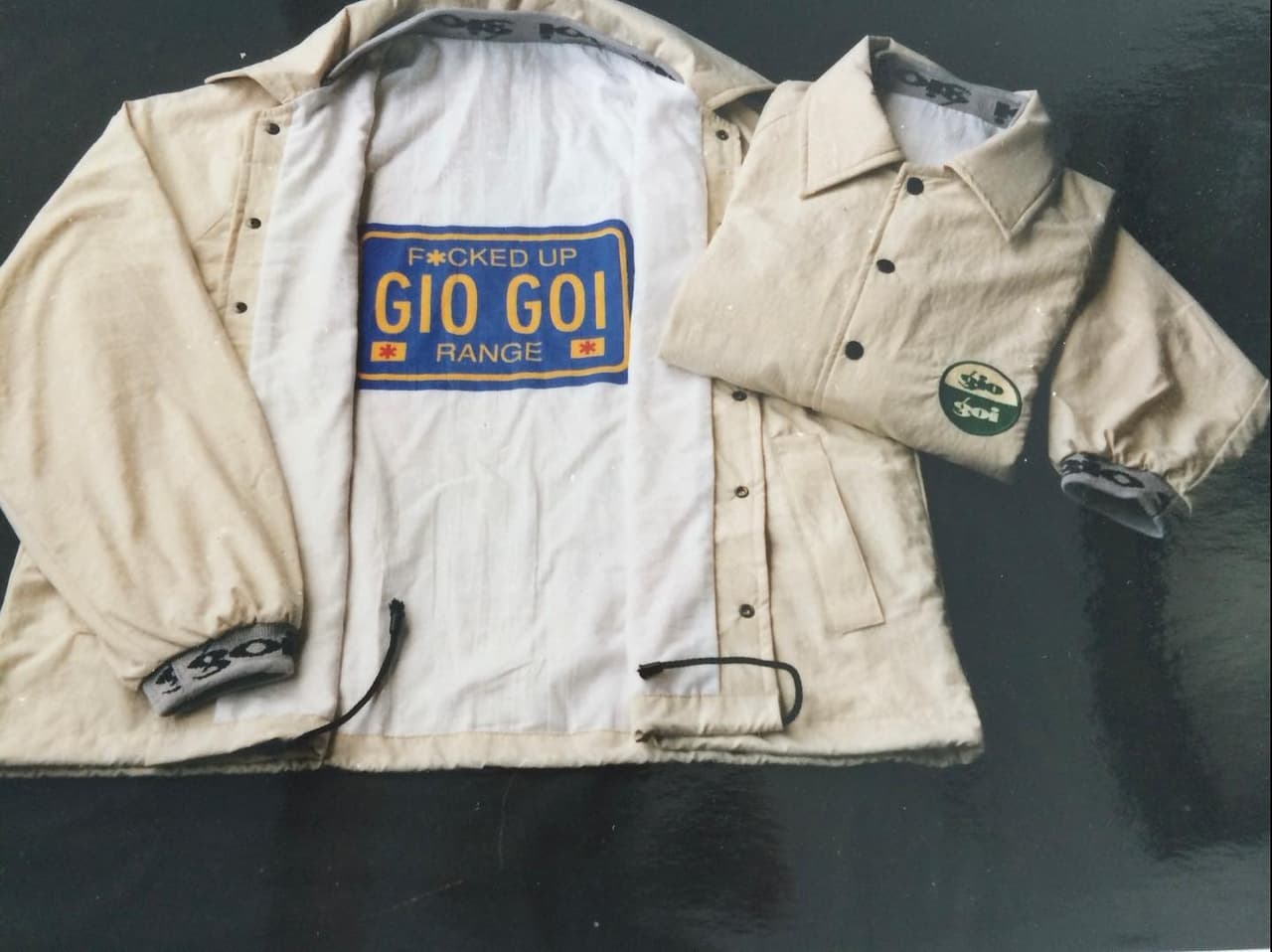 A cream giogoi jacket, open to show its lining label