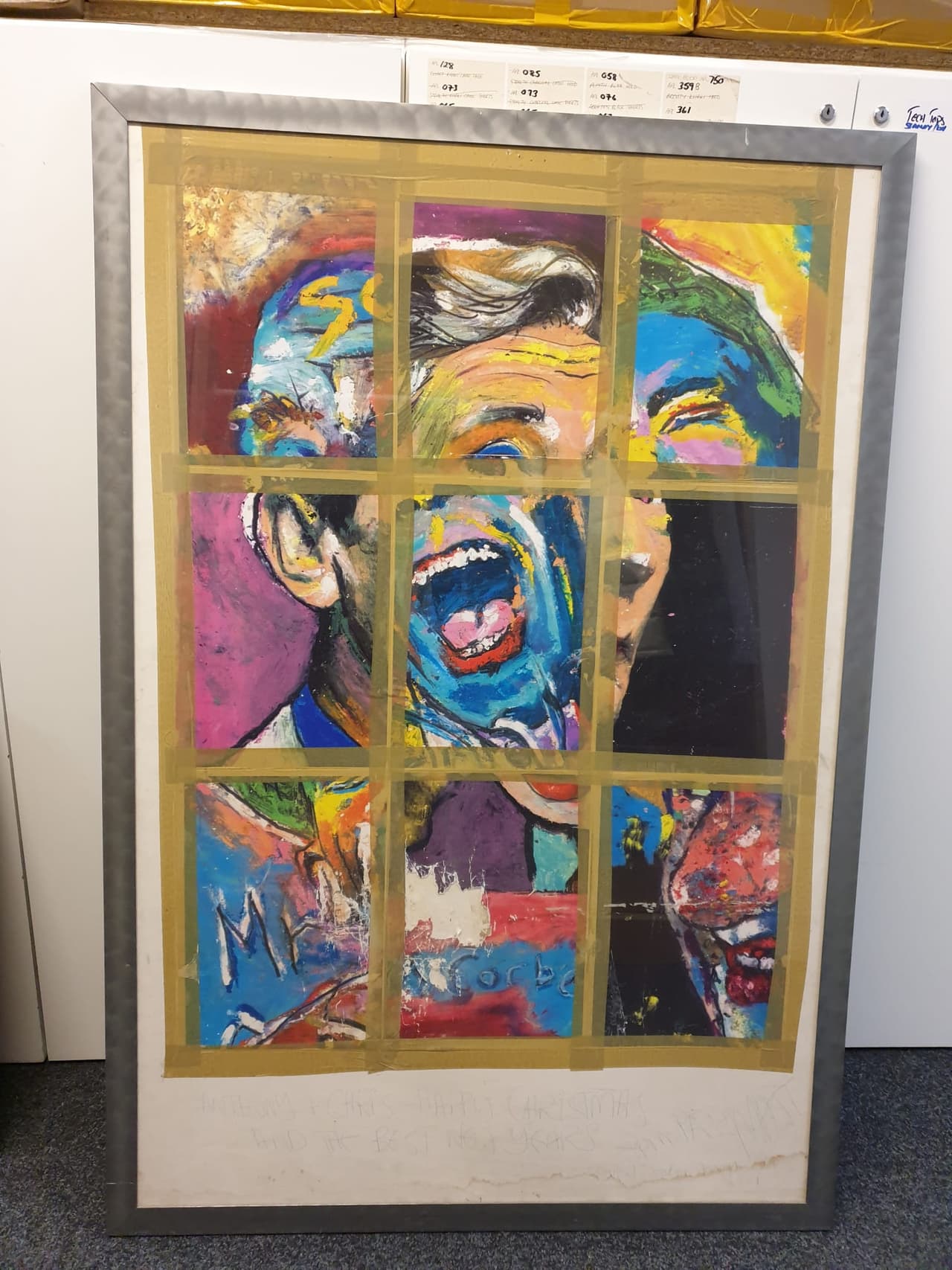 A framed portrait painting in nine colourful panels